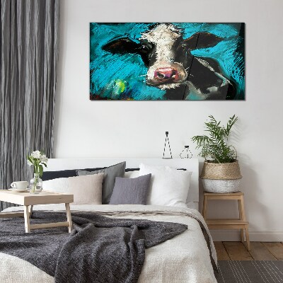 Portrait of a cow on a blue background Glass Wall Art