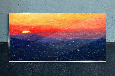 Sunset over a mountain landscape Glass Print