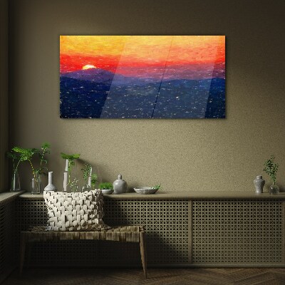 Sunset over a mountain landscape Glass Print