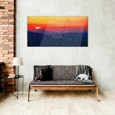 Sunset over a mountain landscape Glass Print