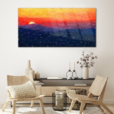Sunset over a mountain landscape Glass Print