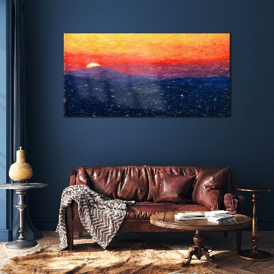 Sunset over a mountain landscape Glass Print