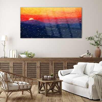 Sunset over a mountain landscape Glass Print