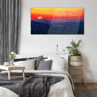 Sunset over a mountain landscape Glass Print