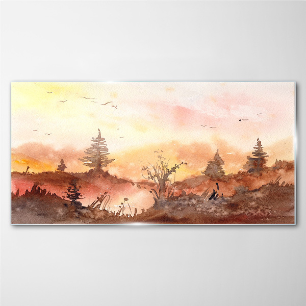 Sunset over a forest landscape Glass Print