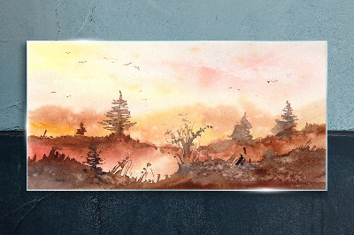 Sunset over a forest landscape Glass Print