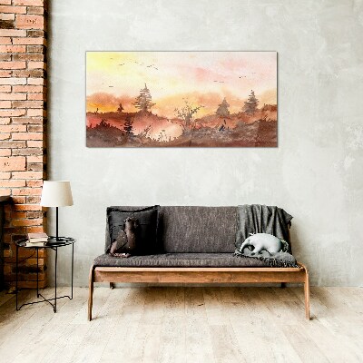 Sunset over a forest landscape Glass Print