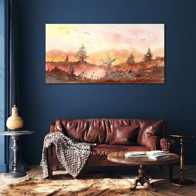 Sunset over a forest landscape Glass Print