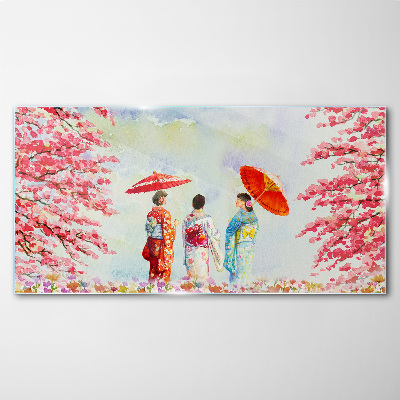 A spring walk under the blooming trees Glass Print