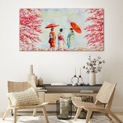 A spring walk under the blooming trees Glass Print