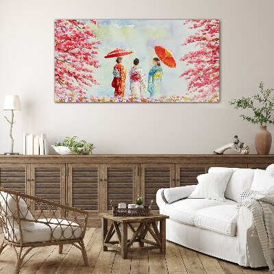 A spring walk under the blooming trees Glass Print