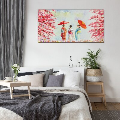 A spring walk under the blooming trees Glass Print