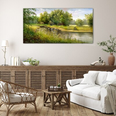 A peaceful landscape by the river Glass Print