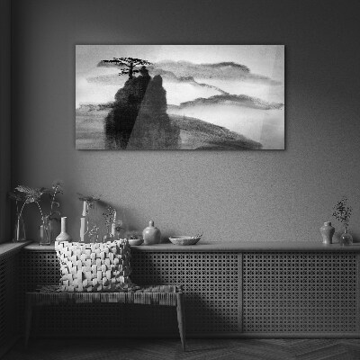 A lonely tree on a rocky mountain Glass Wall Art