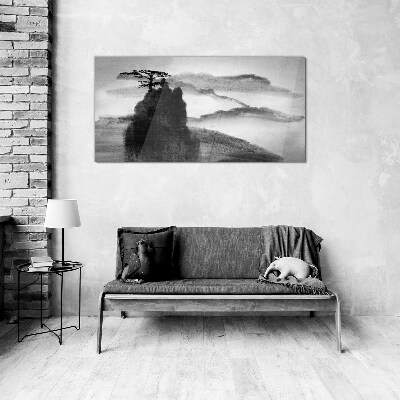 A lonely tree on a rocky mountain Glass Wall Art