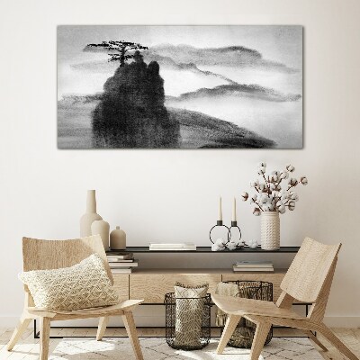 A lonely tree on a rocky mountain Glass Wall Art