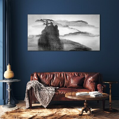 A lonely tree on a rocky mountain Glass Wall Art