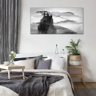 A lonely tree on a rocky mountain Glass Wall Art
