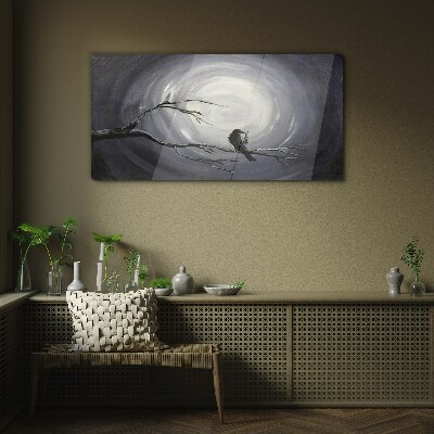A lonely bird on a branch Glass Wall Art