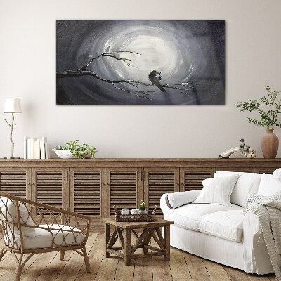 A lonely bird on a branch Glass Wall Art