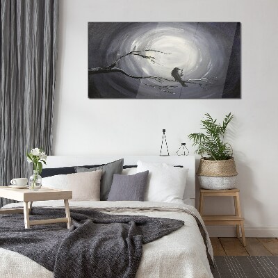 A lonely bird on a branch Glass Wall Art