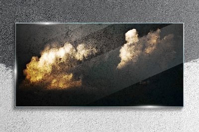 Golden clouds on a dark background Glass Print