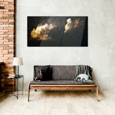 Golden clouds on a dark background Glass Print