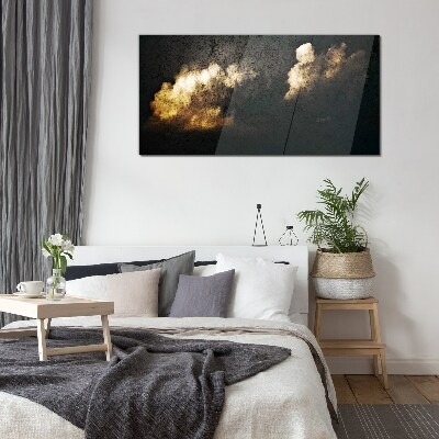 Golden clouds on a dark background Glass Print