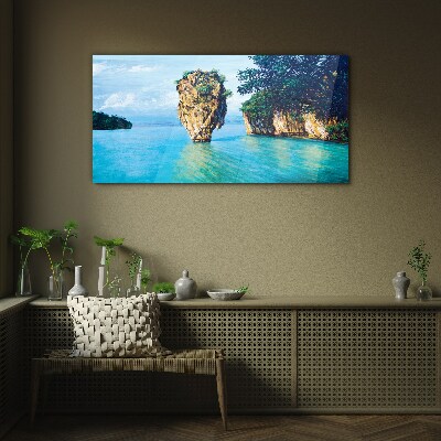 A quiet bay with a high rock Glass Print