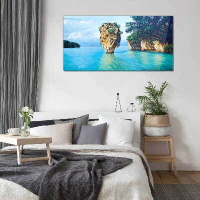A quiet bay with a high rock Glass Print