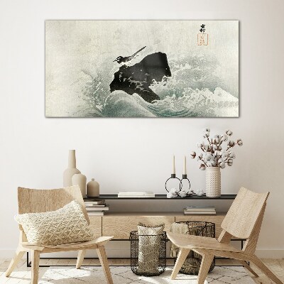 A bird on a rock in the waves Glass Wall Art