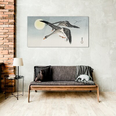 Geese in flight under the full moon Glass Wall Art