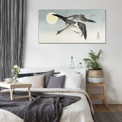 Geese in flight under the full moon Glass Wall Art