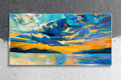 Sunset over a calm lake Glass Print