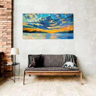 Sunset over a calm lake Glass Print