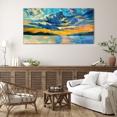 Sunset over a calm lake Glass Print
