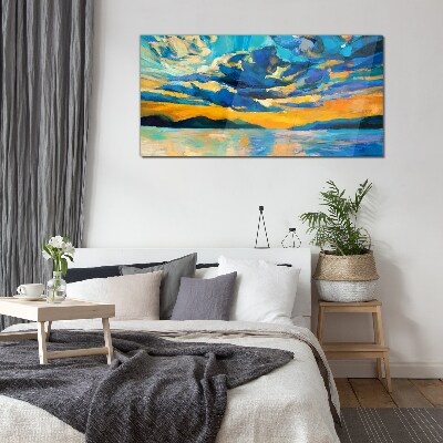 Sunset over a calm lake Glass Print