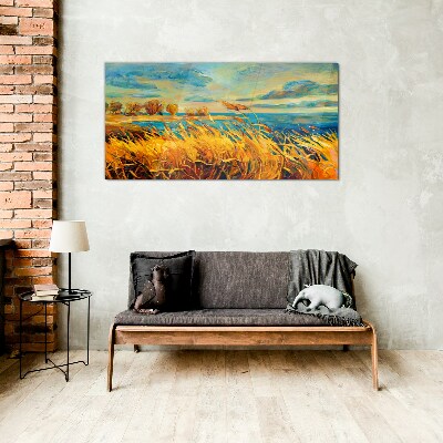 Golden grass over blue water Glass Print