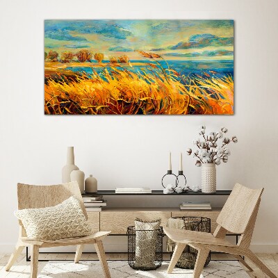Golden grass over blue water Glass Print