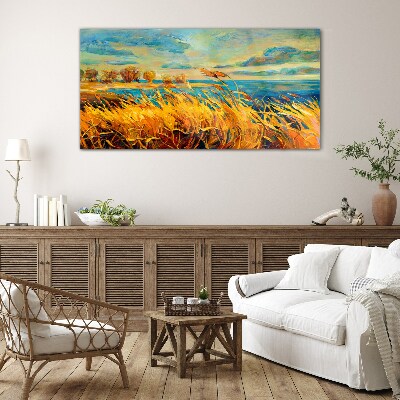 Golden grass over blue water Glass Print