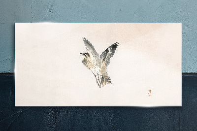 Bird's flight in delicate colors Glass Wall Art