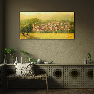 A sunny village among the hills Glass Print