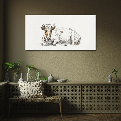 A calm cow in the meadow Glass Print