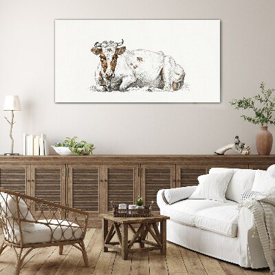 A calm cow in the meadow Glass Print