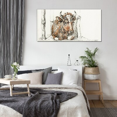 A peaceful cow in a rural setting Glass Print