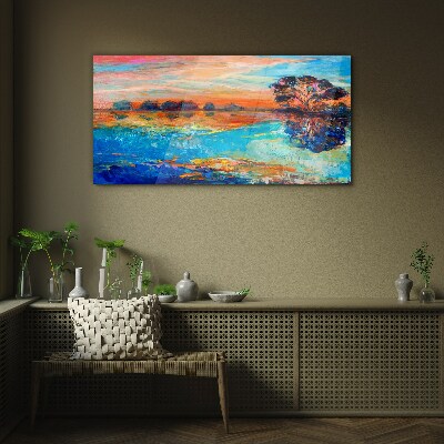 Sunset over the lake Glass Print