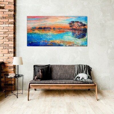 Sunset over the lake Glass Print
