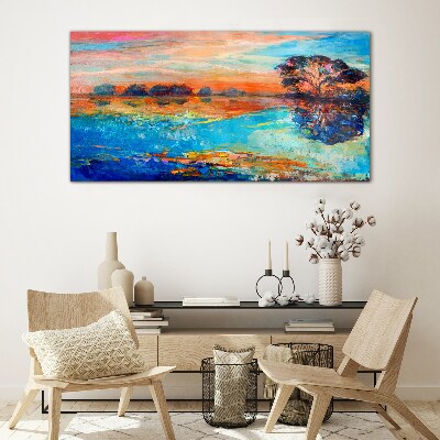 Sunset over the lake Glass Print