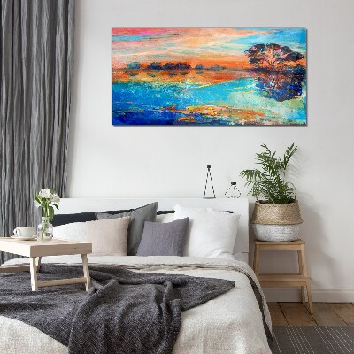 Sunset over the lake Glass Print