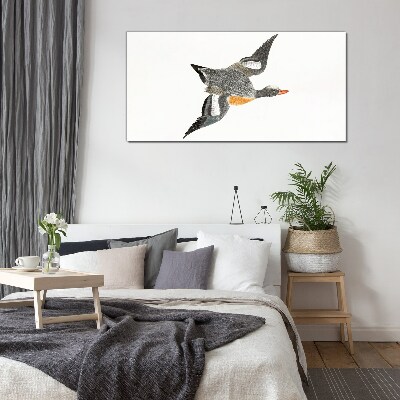 Flying goose in the colors of nature Glass Print